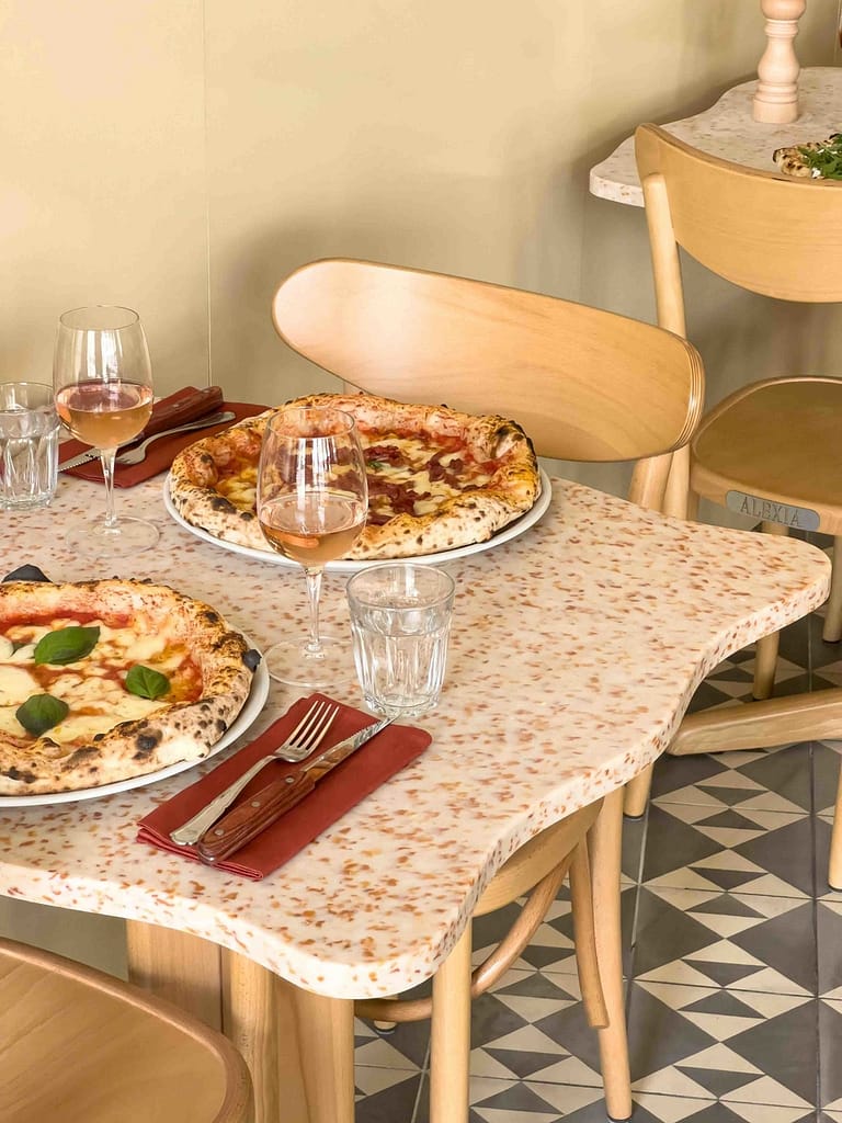 Food presentation table in HOXAR STUDIO's pizzeria restaurant design